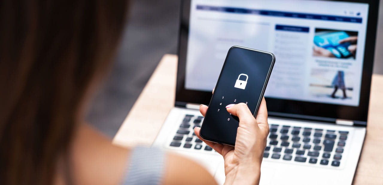 A woman unlocking her smartphone.