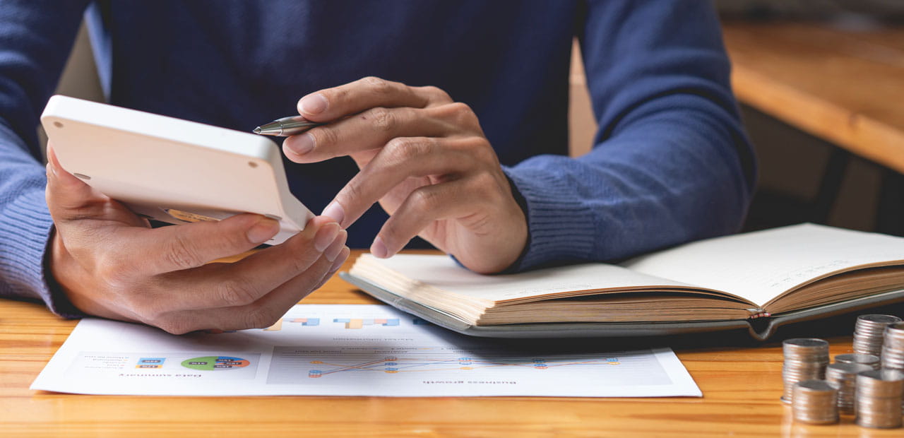 A man using a calculator.