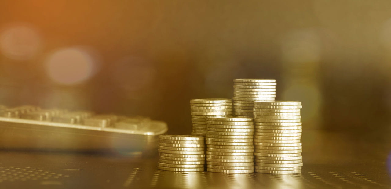 Five stacks of coins with varying heights.